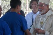Bishop Gerald Kicanas of the Diocese of Tucson celebrated Mass at the Florence Detention Facilty on October 20, 2014. Sr. Lynn Allvin, the Chaplain at Florence Federal Detention Center, is behind him in this picture (DHS).