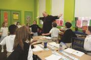 Cardinal Dolan celebrated Mass and visited classrooms during his tour of Saint Francis Xavier School in the Bronx in Oct. 2013.