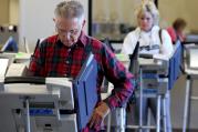 Voters cast ballots in Cleveland as early absentee voting began Oct. 12 ahead of the Nov. 8 U.S. presidential election (CNS photo/Aaron Josefczyk, Reuters).