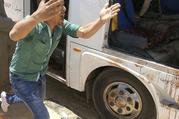 A man screams beside a bus carrying Coptic Christians which came under attack outside Cairo, Friday, Nov. 2, 2018. Islamic militants on Friday ambushed a bus carrying Christian pilgrims on their way to a remote desert monastery south of the Egyptian capital, killing at least seven and wounding a dozen more, the Interior Ministry said.(Egypt’s Coptic Orthodox Church via AP)