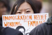 A woman holds a sign during an immigration rally in front of the White House, Nov. 19 (CNS photo/Tyler Orsburn).