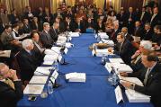 AT THE TABLE. Members of the Senate and House Appropriations Committees hash out differences between versions of legislation in the L.B.J. Room at the U.S. Capitol in February 2009.