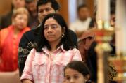 Latino worshippers stand during a special Mass honoring immigrants at St. John the Evangelist Church in Riverhead, N.Y., in 2011. (CNS photo/Gregory A. Shemitz, Long Island Catholic)