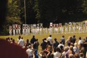 THE GUILTY REMNANT. ￼A mysterious cult protests a parade honoring the departed in the first episode of “The Leftovers.”
