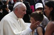 Pope Francis greets a boy during a gathering with young people in Turin, Italy, June 21 (CNS photo/Paul Haring).
