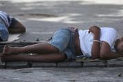 Men sleep on a sidewalk in Georgetown, Guyana, March 14. The World Bank and global faith leaders are joining together to end extreme poverty around the world by 2030. (CNS photo/Bob Roller)