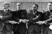 Holy Cross Father Theodore Hesburgh, second from left, and the Rev. Martin Luther King Jr. participate in a June 21, 1964, rally at Chicago's Soldier Field. (CNS photo/National Portrait Gallery) (Oct. 10, 2007)