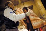  Dr. Patrick Angelo wraps a homeless man in blankets under the overpasses on Lower Wacker Drive in Chicago, ill.