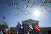 Supporters for same-sex marriage stand outside the U.S. Supreme Court in Washington in April. (CNS photo/Tyler Orsburn)