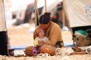 SAFE AT LAST. A woman who fled the violence in the Iraqi town of Sinjar at a camp in Syria’s northern town of Qamishli.