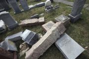 In this Monday, Feb. 27, 2017 file photo,toppled and damaged headstones rest on the ground at Mount Carmel Cemetery in Philadelphia. (AP Photo/Jacqueline Larma)