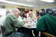 Inmates share a meal at a spiritual retreat held by Thrive for Life at the Otisville Correctional Facility in Otisville, N.Y. (photo courtesy of Thrive for Life)