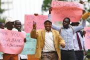 LAW MEN. Men in Kampala, Uganda, Feb. 24, celebrate a new anti-homosexuality law, which imposed a harsh punishment for homosexual acts. The law was struck down in August, but a similar new bill is being considered.