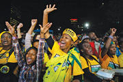VICTORIOUS. African National Congress supporters celebrate the election results in Johannesburg on May 10.