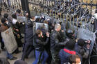 Pro-Russia protesters scuffle with the police at the regional government building in Donetsk.