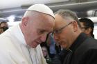 Pope Francis talks with Jesuit Father Antonio Spadaro, editor of La Civilta Cattolica, while meeting journalists aboard his flight to Havana Feb. 12. Traveling to Mexico for a six-day visit, the pope is stopping briefly in Cuba to meet with Russian Orthodox Patriarch Kirill of Moscow at the Havana airport. (CNS photo/Paul Haring)