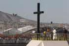 Pope Francis prays at a cross on the border with El Paso, Texas, before celebrating Mass at the fairgrounds in Ciudad Juarez, Mexico, Feb. 17. (CNS photo/Paul Haring) 
