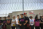 Demonstrators line up alongside a fence inside the Otay Mesa Detention Center in San Diego on June 23 during a rally in support of immigrant families who had been separated at the U.S.-Mexico border. (CNS photo/David Maung)