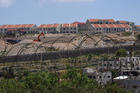 New housing units being built in the Israeli settlement Efrat are seen on the hillside overlooking a Palestinian village near Bethlehem, West Bank, May 10, 2020. The Vatican issued a statement May 20 stating concerns about an Israeli plan to unilaterally annex a large portion of land in the West Bank. (CNS photo/Debbie Hill) 