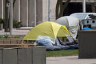 Homeless camp set up in park in middle of University Avenue in downtown Toronto by the Court House during Covid-19 pandemic on April 3, 2020.