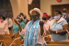 Faithful in Miami sing during Mass at St. Mary Cathedral on the feast of the Assumption, Aug. 15, 2021. (CNS photo/Marlene Quaroni, Florida Catholic)