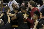 Cleveland Cavaliers forward LeBron James (23) hugs Kyrie Irving after Game 7 of basketball's NBA Finals against the Golden State Warriors. The Cavaliers won 93-89. (AP Photo/Eric Risberg)