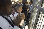  Faith leaders pray at the main entrance to the Otay Mesa Detention Center in San Diego June 23 during a march and rally in support of immigrant families who had been separated at the U.S.-Mexico border. (CNS photo/David Maung, EPA)