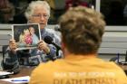 Vivian Tuttle holds a photo of her daughter Yvonne, who was murdered during a 2002 bank robbery in Norfolk, Neb., as she testifies in favor of the death penalty at a public hearing in Omaha, Neb. in October 2016 (AP Photo/Nati Harnik, file).