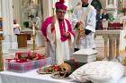 Auxiliary Bishop Jorge H. Rodriguez-Novelo blesses the remains of Julia Greeley in the Cathedral Basilica of the Immaculate Conception in Denver on Wednesday, June 7, 2017. (AP Photo/Colleen Slevin)