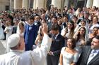 Pope Francis greets newly married couples during his general audience in St. Peter's Square at the Vatican in this Sept. 30, 2015, file photo. 