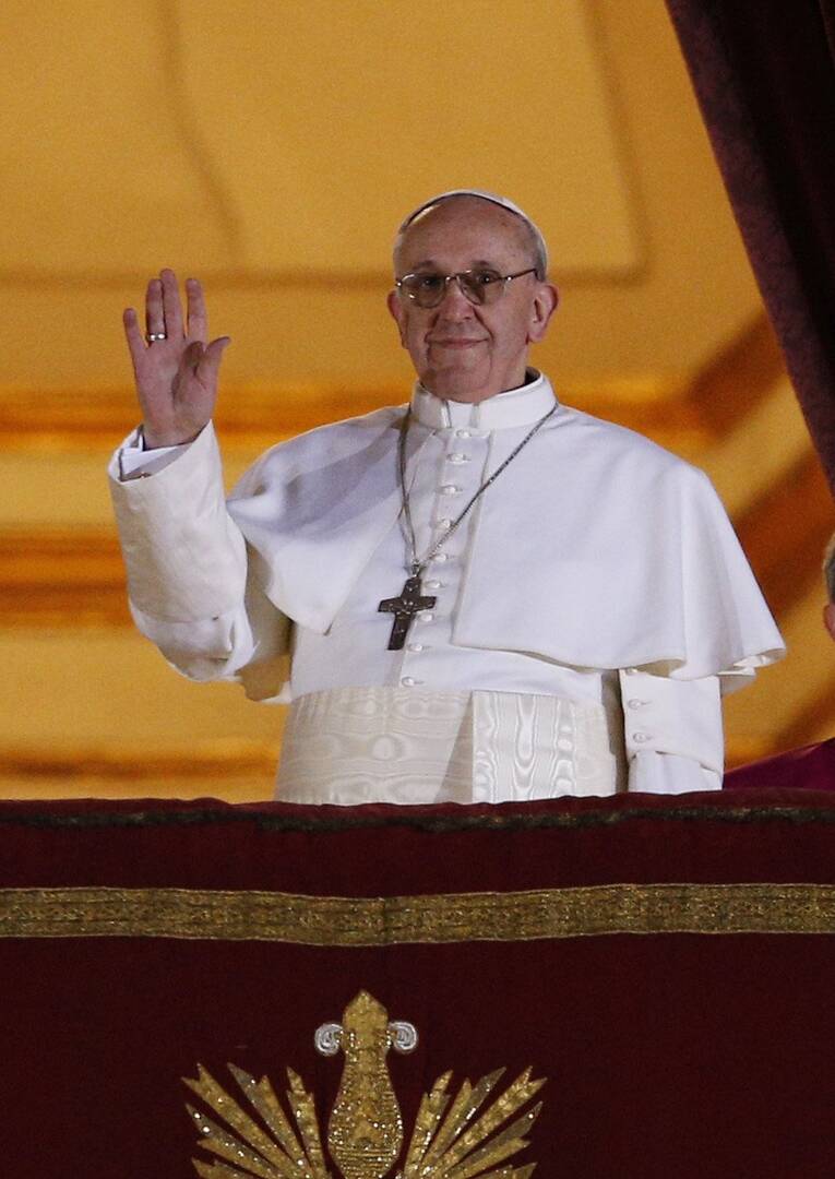 Pope Francis waves to the crowd as he appears for the first time on the central balcony of St. Peter’s Basilica at the Vatican on March 13, 2013. (CNS photo/L'Osservatore Romano)