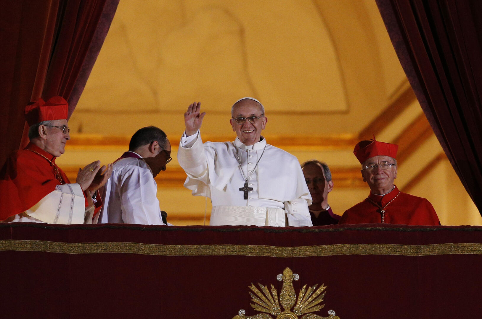 Pope Francis waves from the balcony of St. Peter's Square