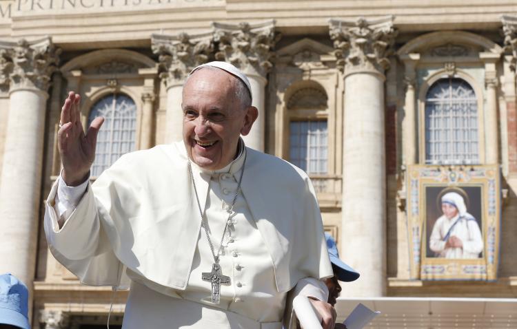 Image: Pope Francis passes a tapestry of Blessed Teresa of Kolkata as he arrives for an audience in St. Peter's Square at the Vatican Sept. 3. (CNS photo/Paul Haring)