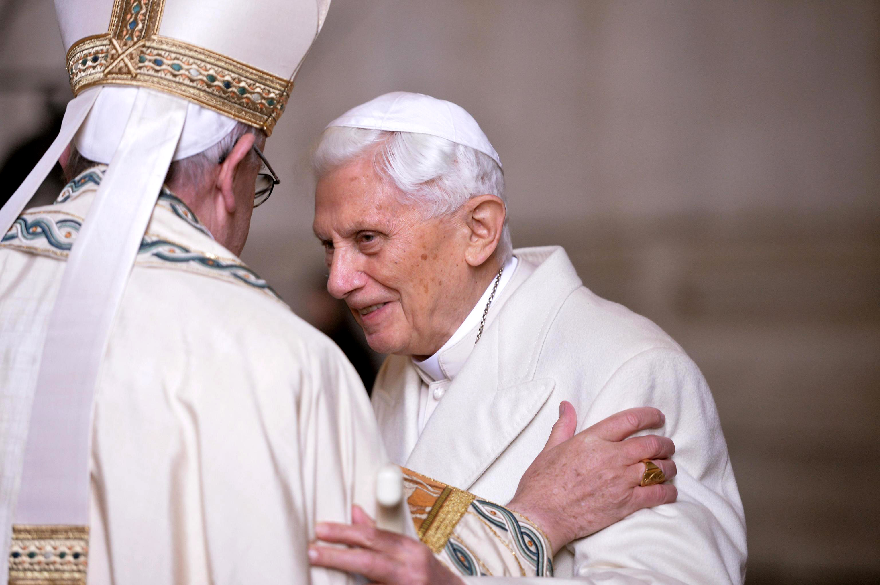 Pope Francis greets retired Pope Benedict XVI in a 2015 photo. (CNS photo/Maurizio Brambatti, EPA)