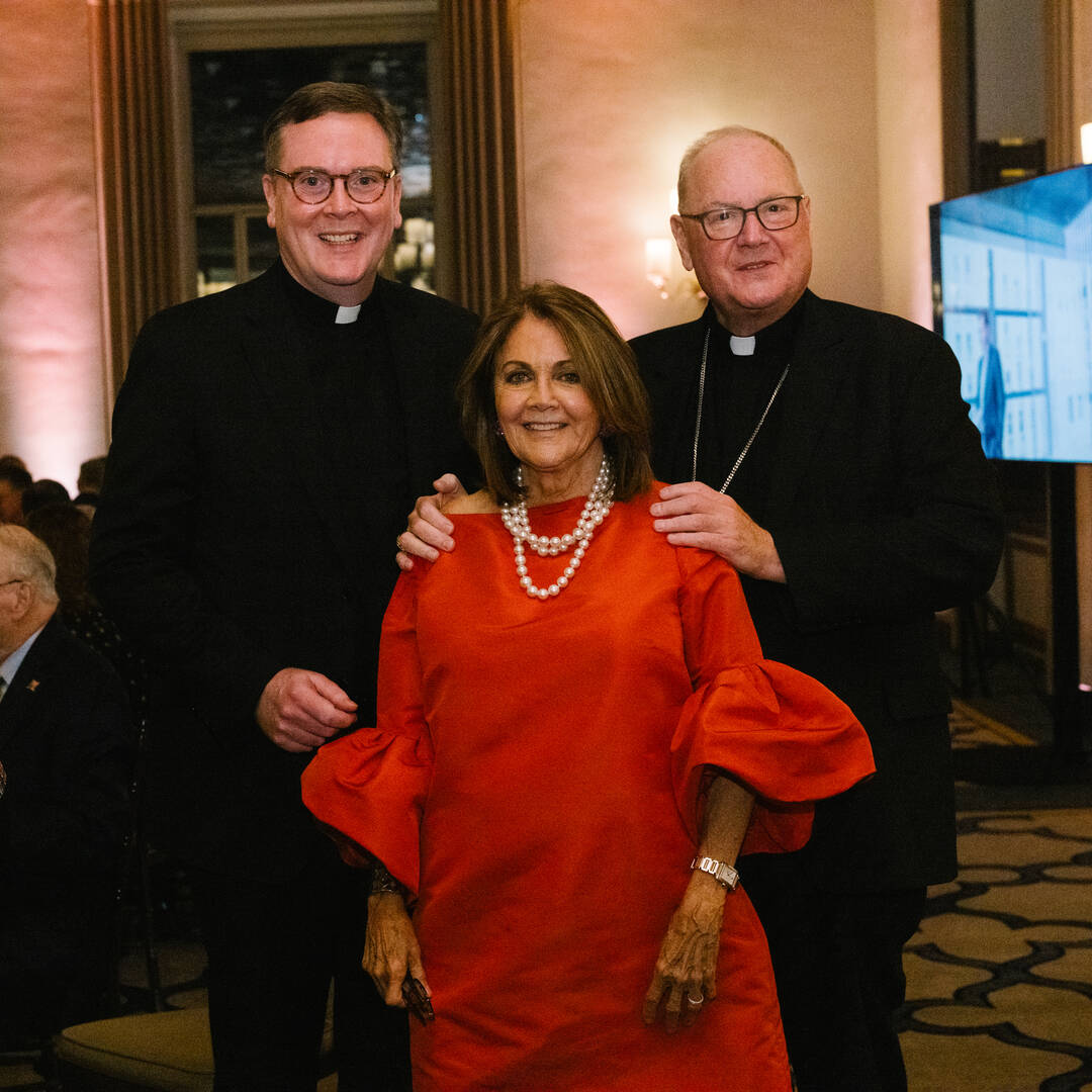 Susan Braddock pictured with Matt Malone, S.J., the former editor of America, and Cardinal Timothy Dolan