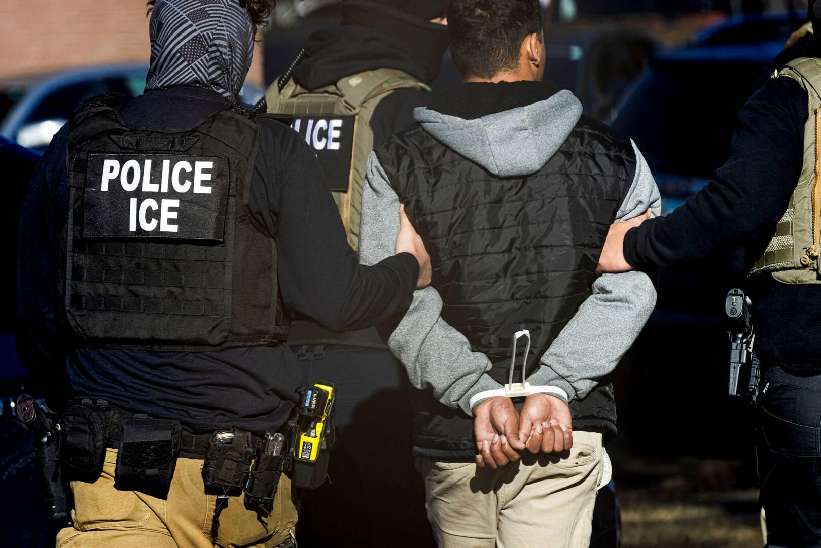 Agents with the Immigration and Customs Enforcement (ICE) detain a man after conducting a raid at the Cedar Run apartment complex in Denver Feb. 5, 2025. (OSV News photo/Kevin Mohatt, Reuters)