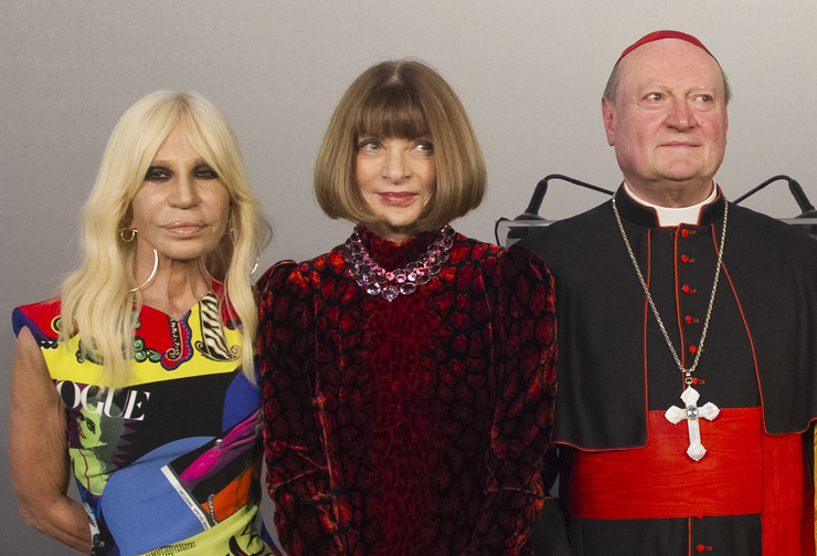 Cardinal Gianfranco Ravasi, right, designer Donatella Versace, left, and Vogue Editor-in-Chief Anna Wintour pose for photos at Palazzo Colonna in Rome. (AP Photo/Domenico Stinellis)
