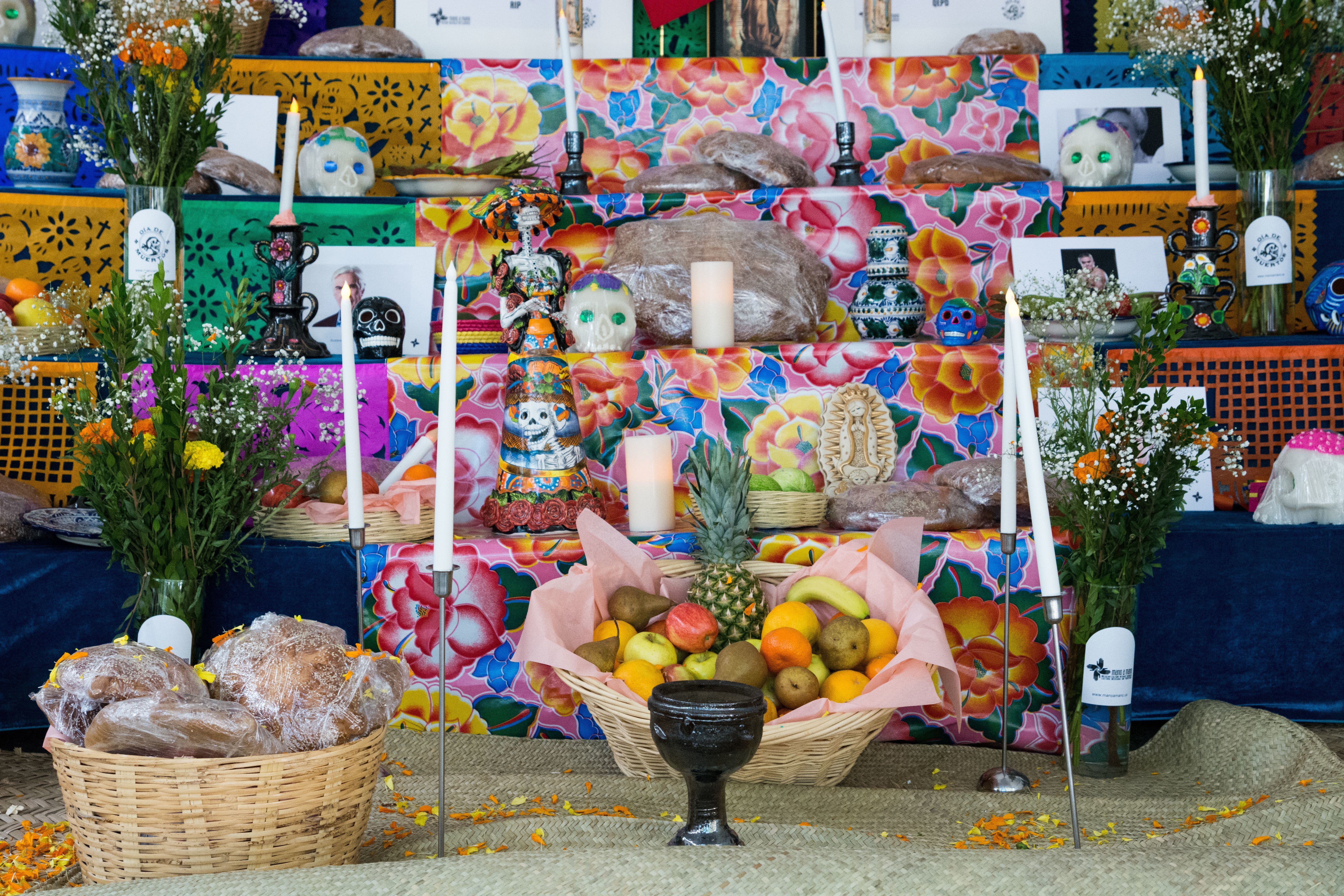 Altar for Mexican holiday with symbols of life, death and pictures of the recently deceased by the Mano a Mano Mexican cultural organization. 'Day of the Dead' altar, St. Marks Church In-the-Bowery, New York, USA - 27 Oct 2017 (Rex Features via AP Images)