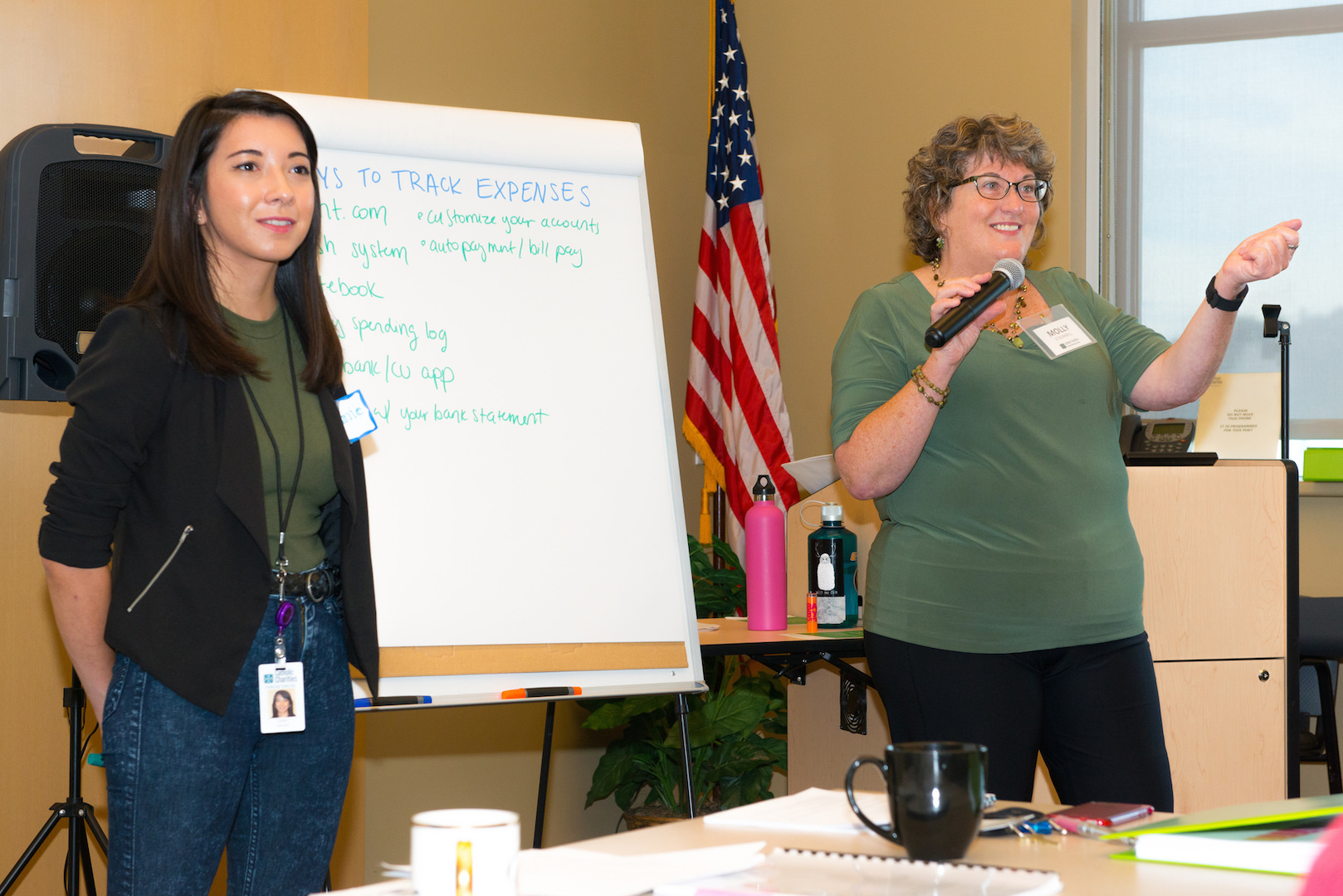 Joanie Barnard and Molly O'Donnell of the Family Success Center are seen in an undated photo teaching a budgeting class in Portland, Ore. The new Catholic Charities center, currently under construction, will provide a range of financial wellness services to clients in one location. (CNS photo/courtesy Catholic Charities of Oregon)