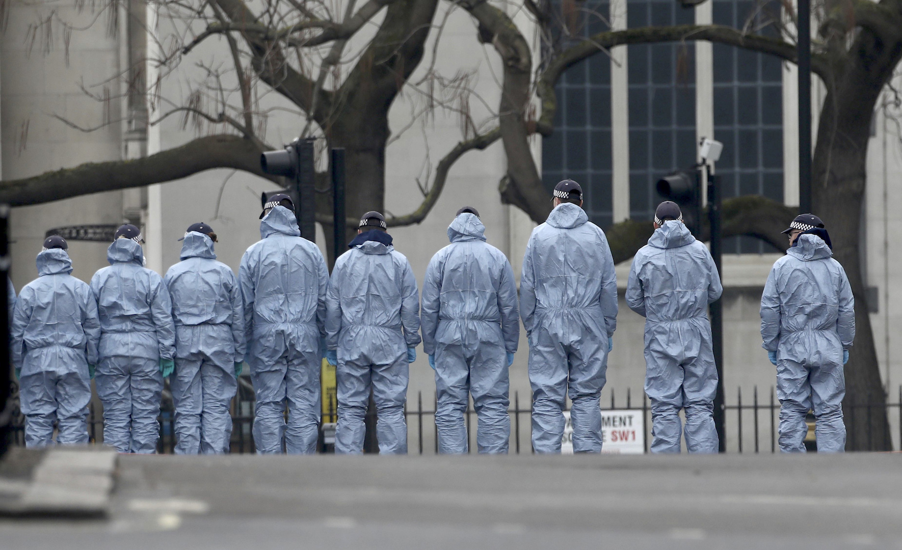 Forensic officers prepare to crawl on the road next to Westminster Abbey to look for evidence March 23, the day after an attack in London. (CNS photo/Neil Hall, Reuters)