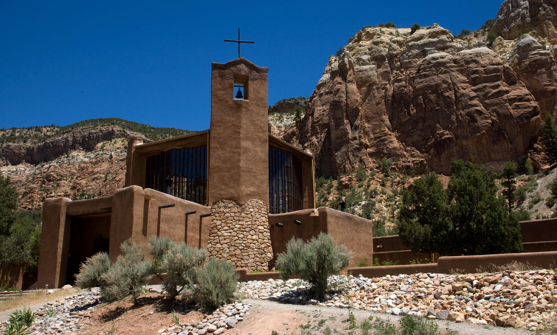 The Benedictine Monastery of Christ in the Desert in New Mexico is built from the same stone as the mesas that rise behind it, as though it had been carved out from them (photo: CNS).
