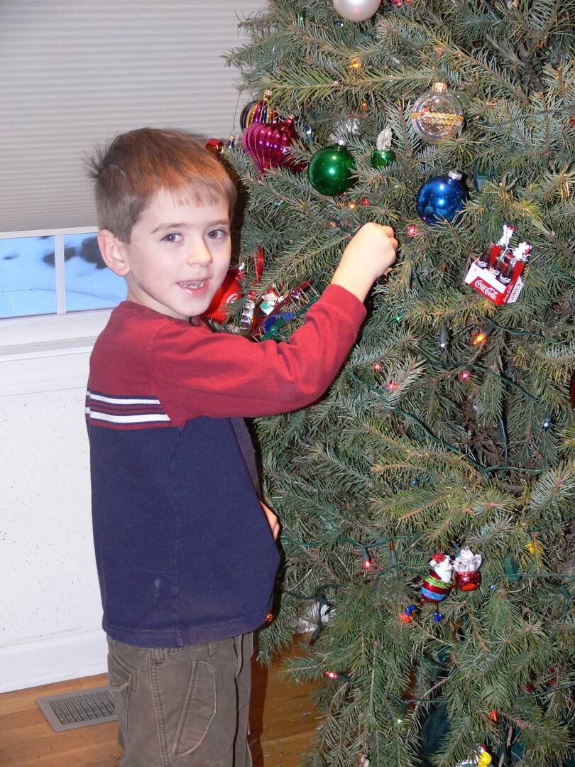 The author hanging Christmas ornaments, back when he was young and innocent.