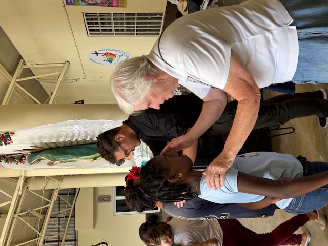 Sister Rose Kuhn and Billy Critchley Menor, S.J., offer blessings during Mass at Casa del Migrante in Reynosa, Mexico. (Photo provided by authors)
