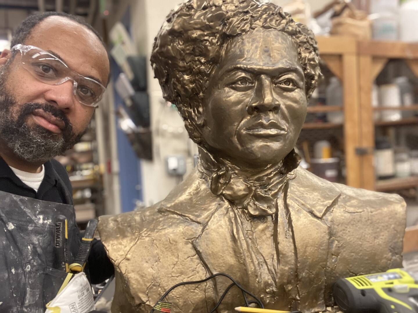 Wayman Scott with sculpture of Frederick Douglass