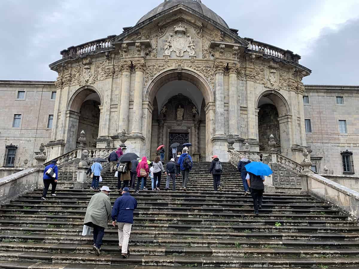 Pilgrims walk up the steps to the Basilica of St. Ignatius Loyola