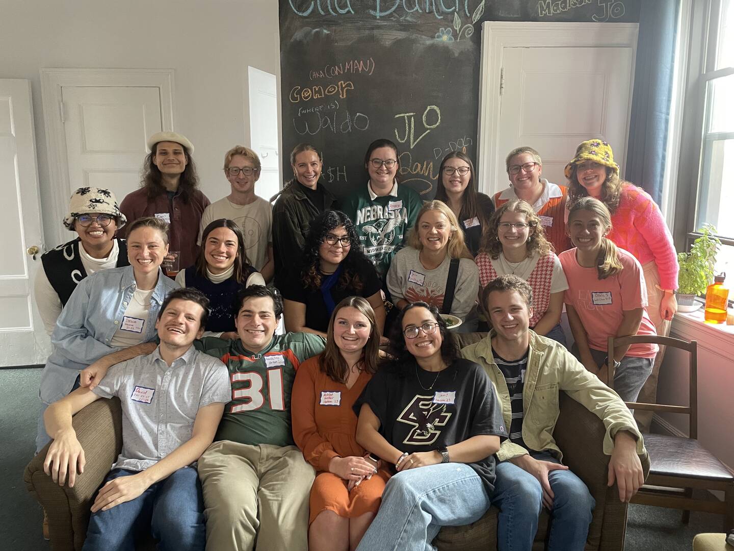 Past and present (front row) Jesuit Volunteers gather at the Ella Baker House in New York City. Courtesy of Jen Lozano, Jesuit Volunteer