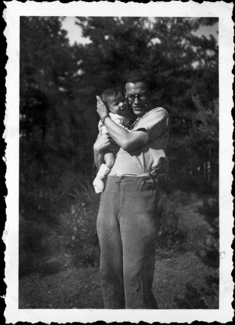 Pierre Sauvage as a baby in the arms of father Léo Sauvage in Le Chambon in 1944 (with old photo borders). Courtesy of Chambon Foundation for _America