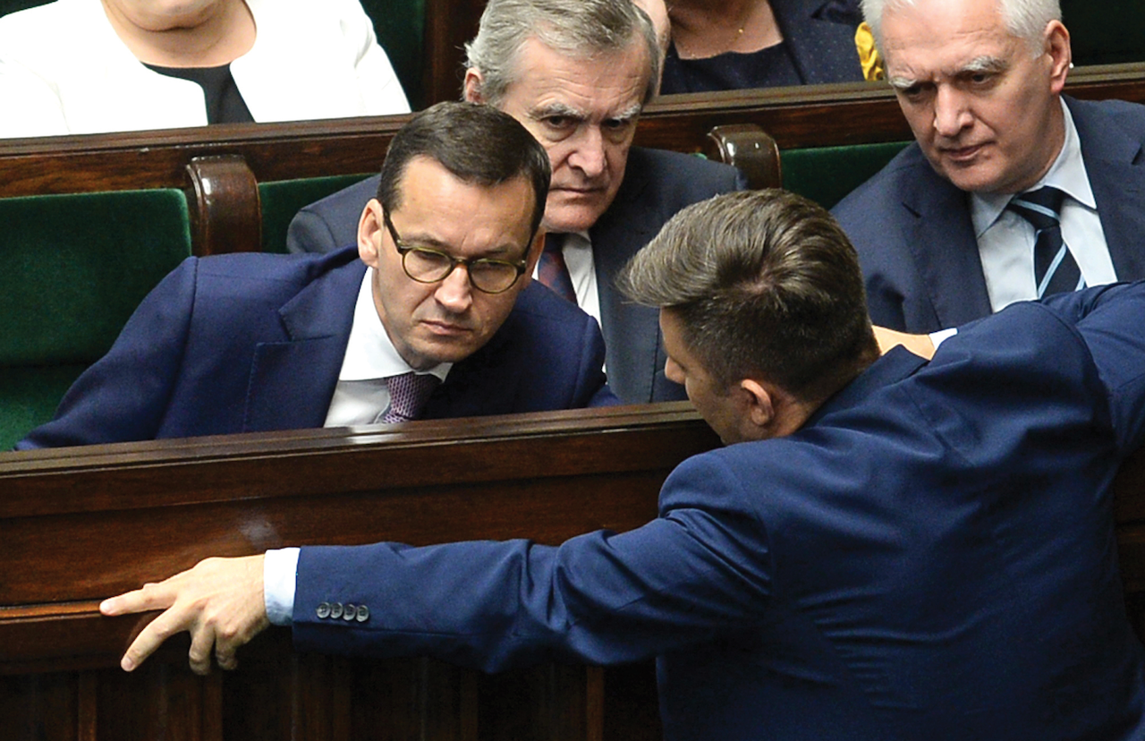 Polish Prime Minister Mateusz Morawiecki, left, during a parliament debate on changes to a controversial Holocaust law, Warsaw, June 27. (AP Photo/Alik Keplicz)