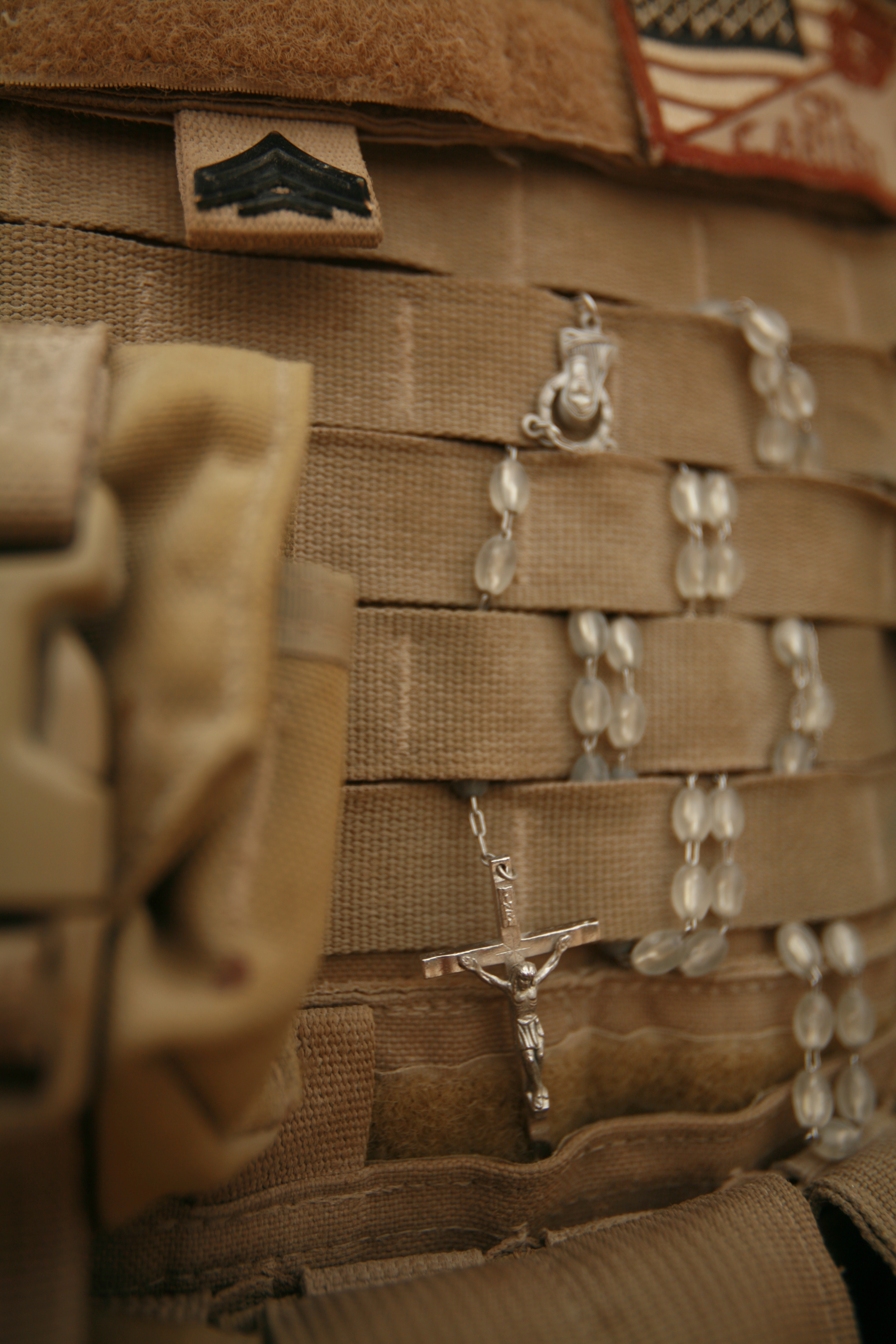 Rosary in flak jacket - photo by Wayne Edmiston