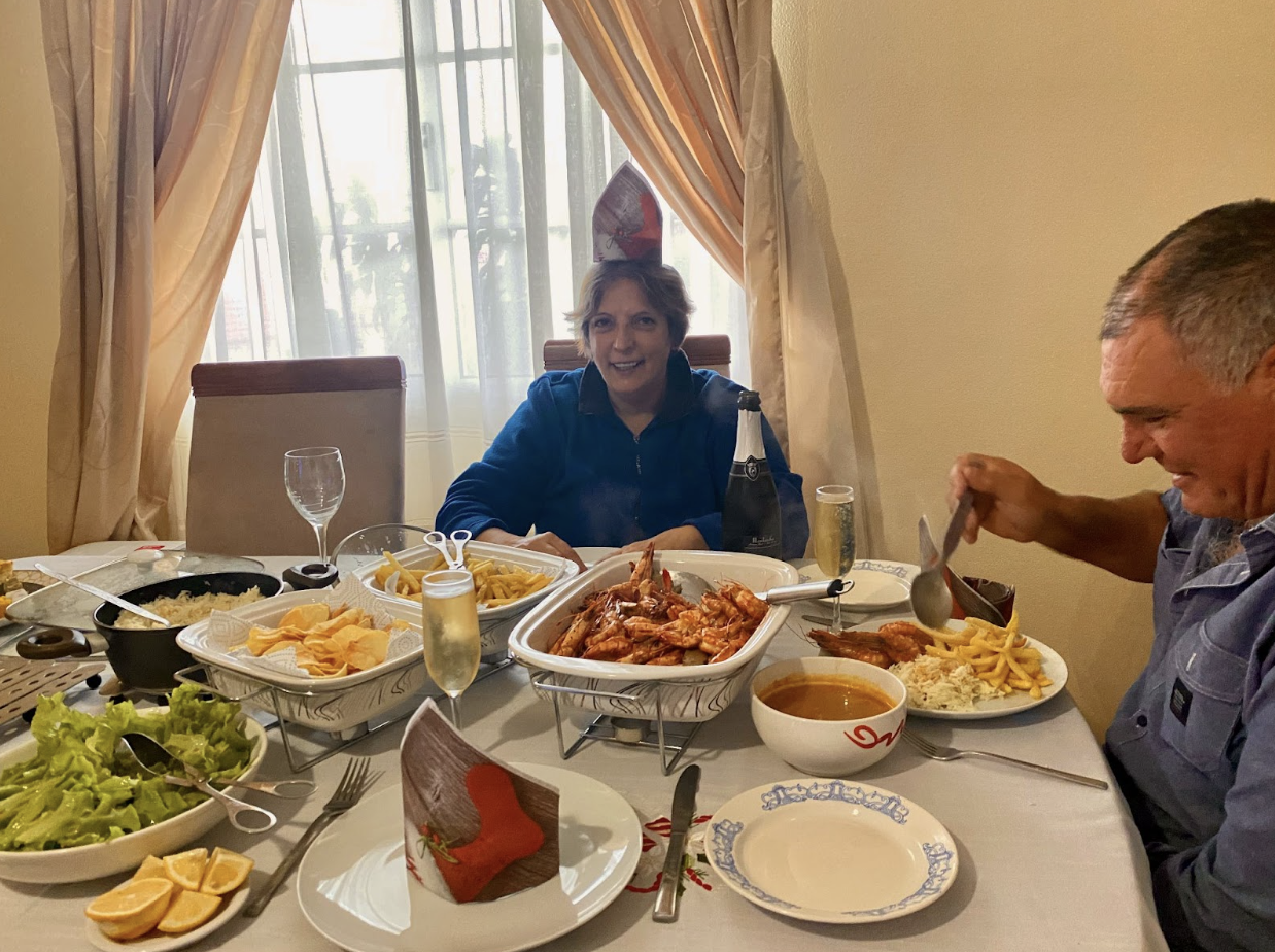 Author's mother smiling at the holiday meal table